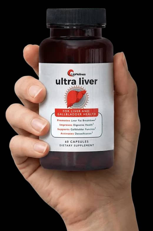 Hand holding a bottle of Ultra Liver